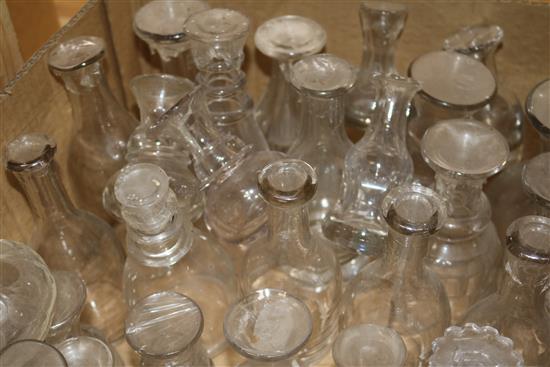 A quantity of glass decanters lacking stoppers